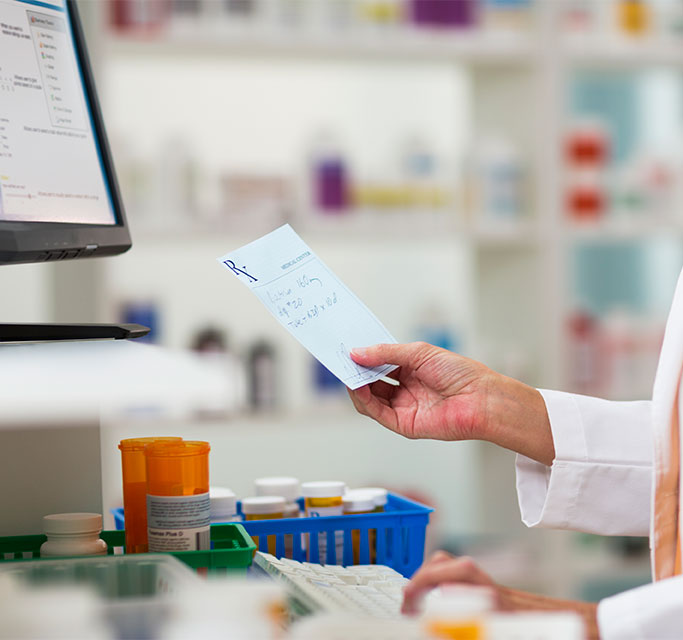 Pharmacist Holding Prescription