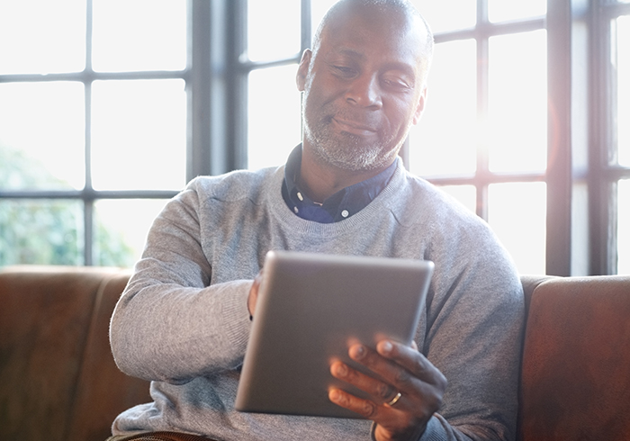 Man on Ipad browsing ReadyMeds